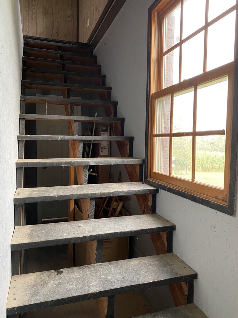 Staircase leading from the garage to bonus room