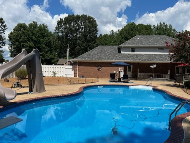 Pool with slide and diving board