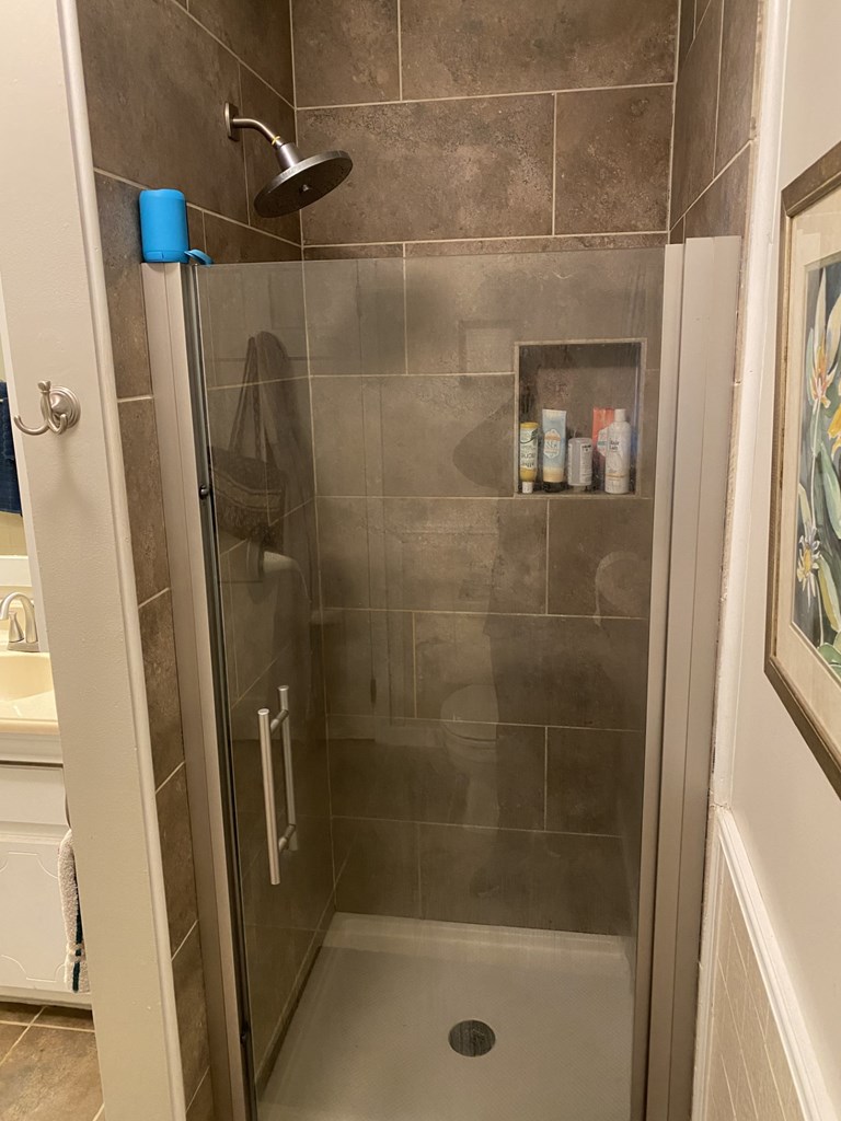 Tiled shower in owner's suite bathroom