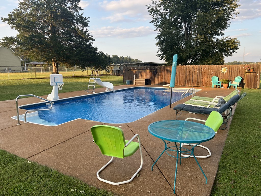 Additional view of pool with privacy fence